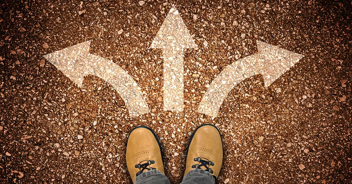 leather shoes with three arrows representing different directions or paths to take